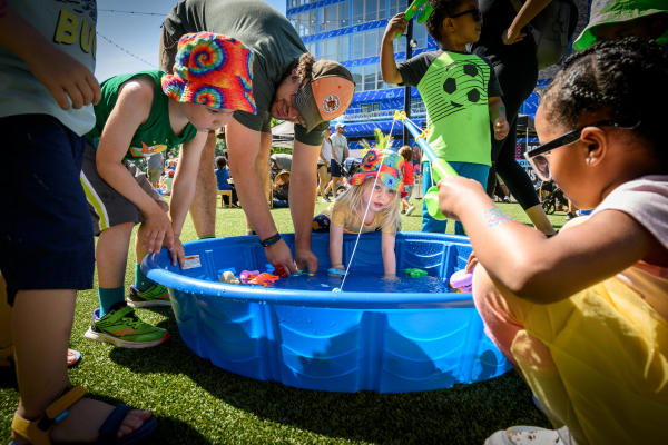 Kids playing at Color Burst Park in Merriweather District