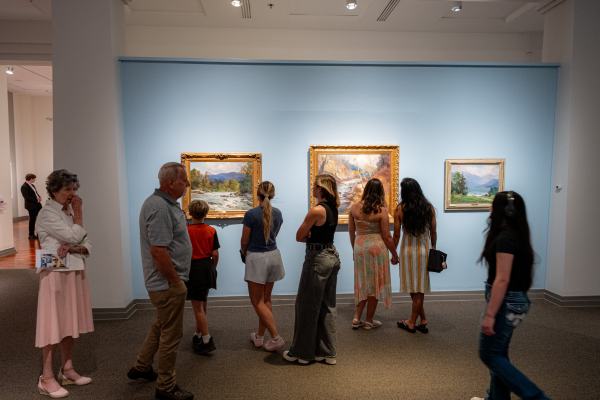 people perusing an art gallery