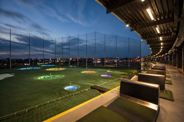 Outside in one of the bays at Top Golf, located in the Mid City District