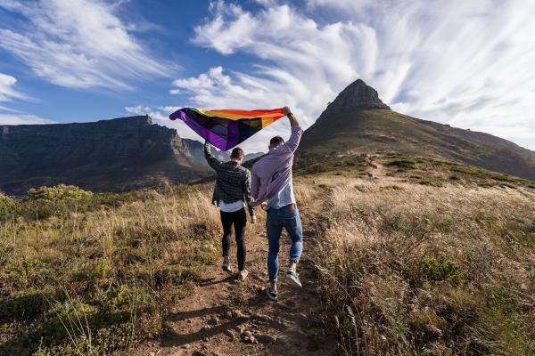 Gay Couple Waving LGBT Flag