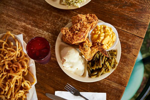 Dinner of fried chicken, green beans, mashed potatoes, and macaroni