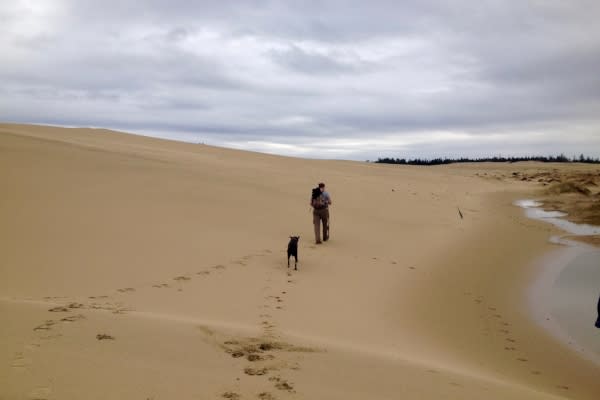 Hiking with Dog Across the Oregon Dunes by Dina Pavlis