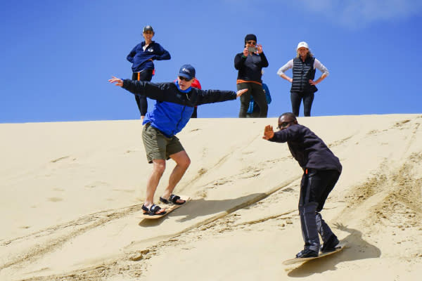 Group Sandboarding at Coast