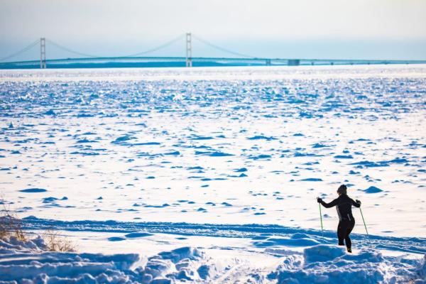 Person skiing on snow-covered trail