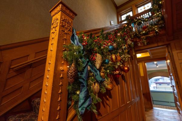 Christmas in the mansion gardland on stairs with banister