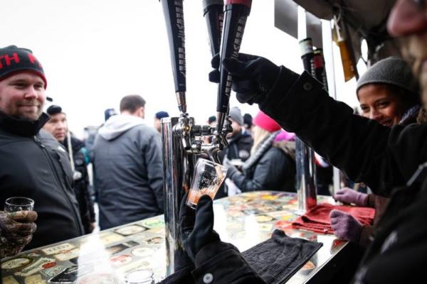 Pouring tap beer in the winter