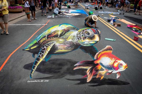 3D sidewalk chalk art painting of a sea turtle and fish