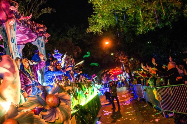 Mardi Gras float and a crowd of people celebrating