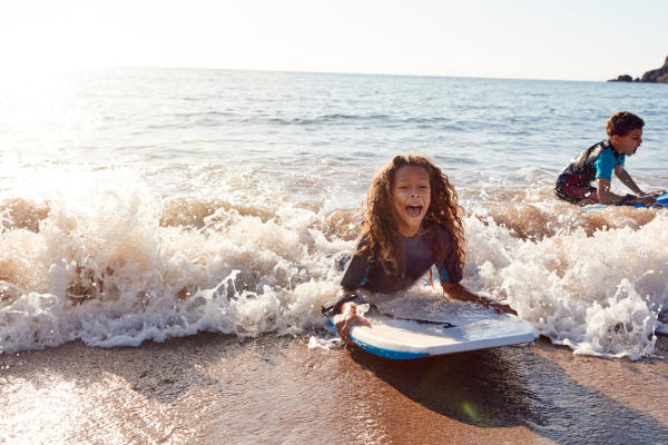 Kids playing in surf