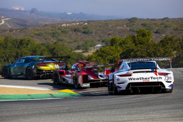 Cars racing on WeatherTech Raceway Laguna Seca racetrack