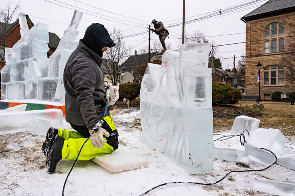 a person carving Ice Sculpt
