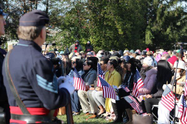 People holding American Flags in hands