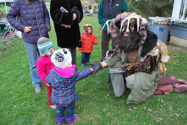 A Belsnickle - the PA Dutch character that visits naughty children at Christmas meets children at Christmas on the Farm. He is a scary sight wearing animal furs, a long black beard and soot-covered face. His fur cap is adorned with antlers.