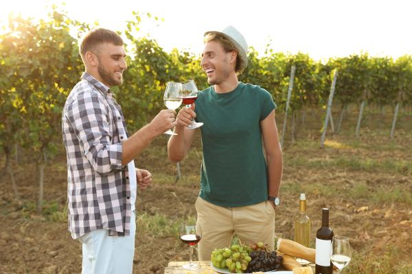 Friends-Holding-Glasses-Of-Wine
