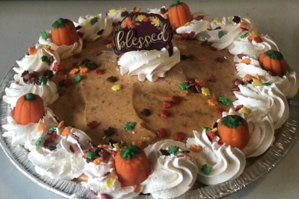 Holiday themed ice cream pie with pumpkins and sprinkles