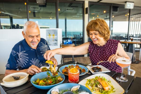 A couple enjoying a number of dishes at La Capannina Italian Restaurant.