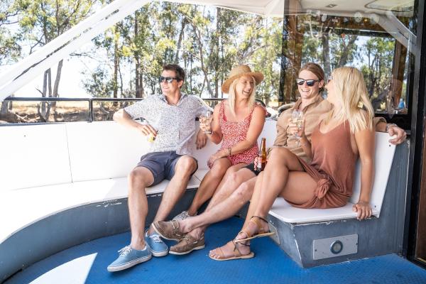 Group of friends aboard a Swan Valley Tours cruise on the Swan River