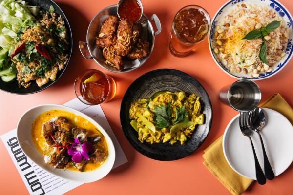 Laap Mu Muang, Gai Tawt Won Pen, Yam Mamuang Boran, Boo Pad Pong Garee, and Ba Buey Khlak Ti paired with a cocktail and a beer at Lom Wong