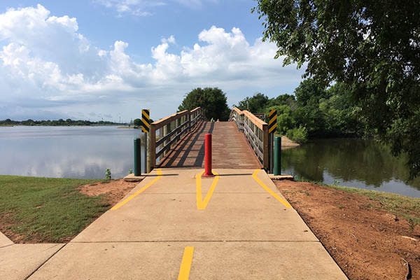 A bridge over the water at Boomer Lake in Stillwater, OK