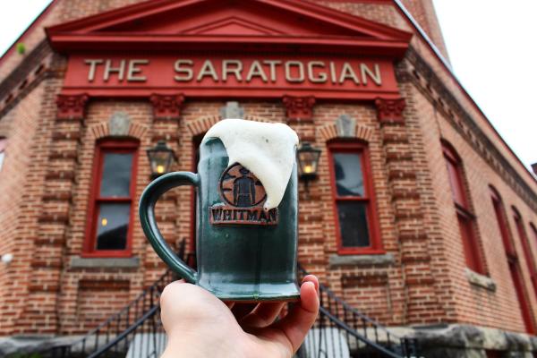 mug of beer in front of building