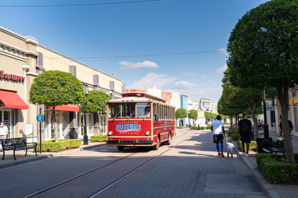 Shoppers ride motorized trolley at Louisiana Boardwalk Outlets, Bossier City, La.