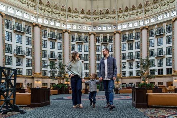 Couple with baby in West Baden Springs Hotel Atrium
