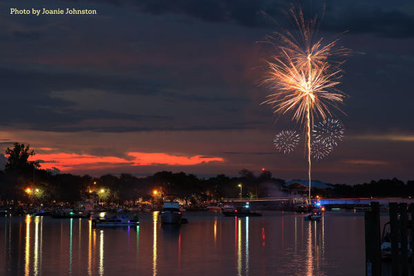 Madisonville 4th of July fireworks at sunset over the Tchefuncte River_photo by Joanie Johnston
