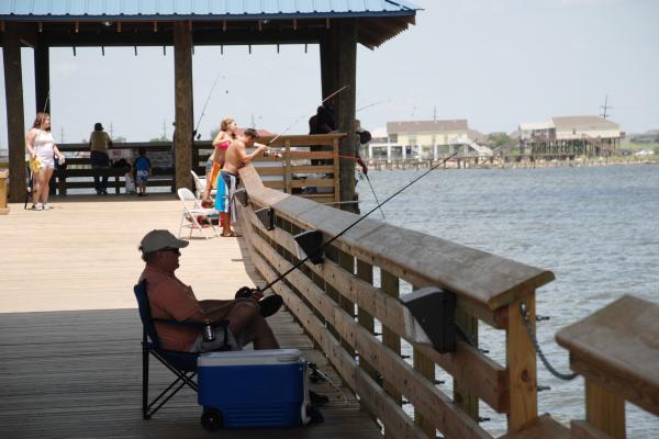 People fishing along the St. Tammany Fishing Pier in Slidell, LA
