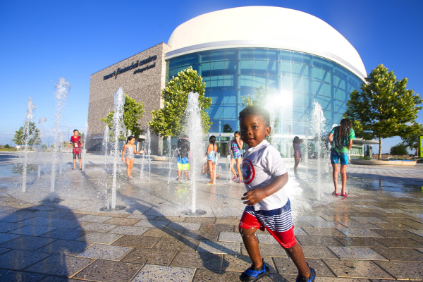 Children playing in the splash pad at Smart Financial Centre