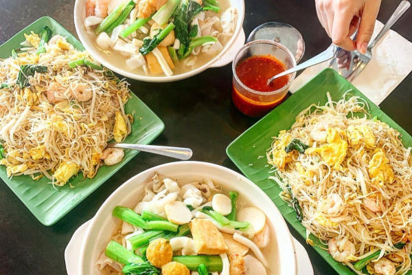 Large spread of dishes from Singapore Cafe.