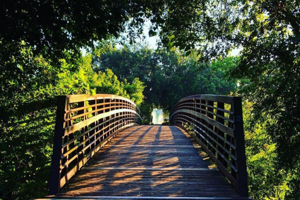 Walking bridge over Oyster Creek in park of the same name
