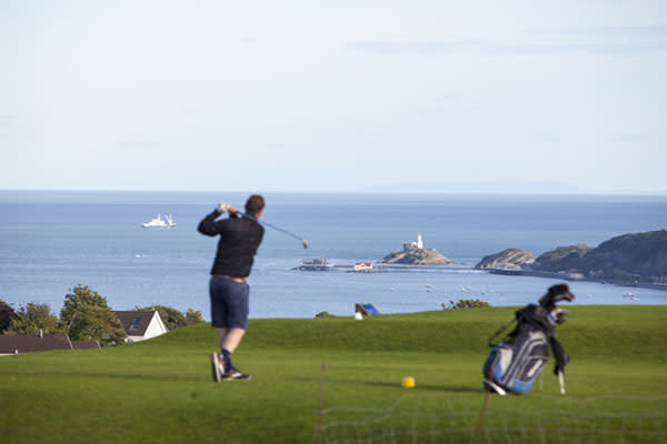 A man playing golf.
