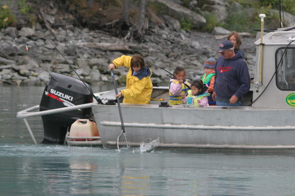 a family fishes from a boat