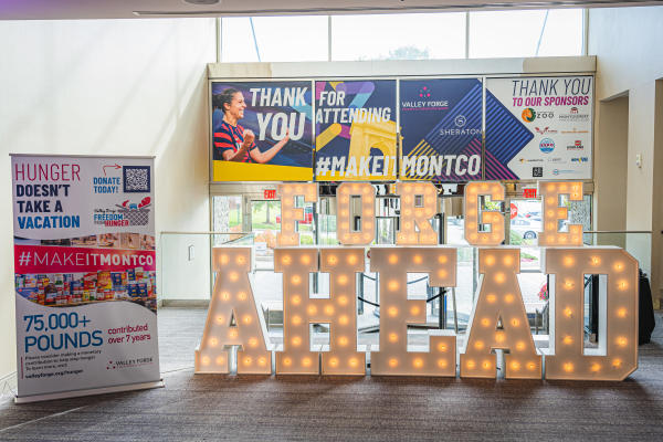 Light up letter sign "FORGE AHEAD", "Thank you for attending, #MAKEITMONTCO, Thank you to our sponsors"