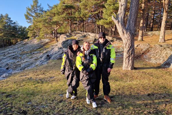 three people on land