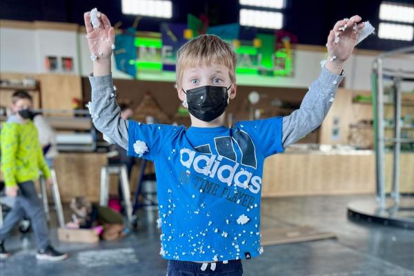 A child gets messy at Keystone Kidspace