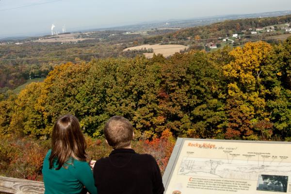 A couple enjoys the changing leaves at Rocky Ridge Park