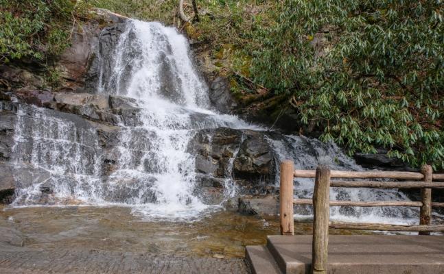 A paved trail passes in front of Laurel Falls in the Great Smoky Mountains.