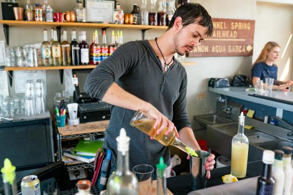 Bartender pouring drinks at Broken Trail