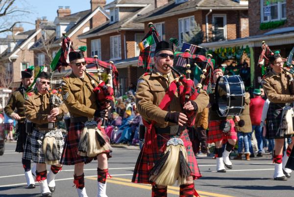 Bagpipers playing and marching in the Allentown St. Patrick's Day parade.