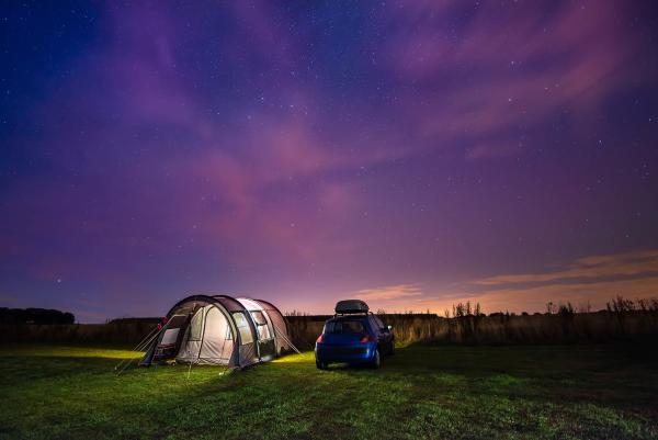 tent and car in twilight