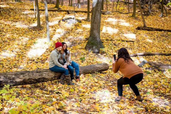 Couple getting photo taken in fall scene in Green Bay