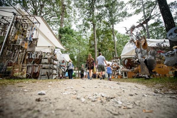 Monte Sano Art Festival people walking with tents on either side