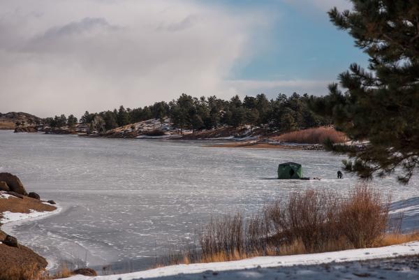 ice fishing hut on frozen lake
