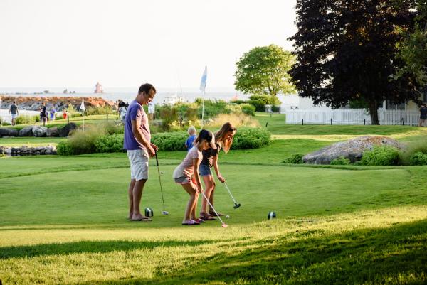 family golfing