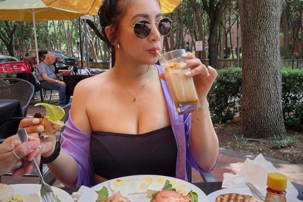 Woman having lunch a Astoria Cafe