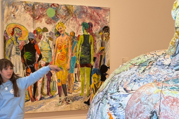 Two young ladies admiring a piece of art at the Akron Art Museum.
