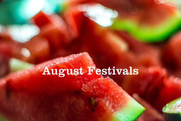 Cut up pieces of Watermelon on a table.