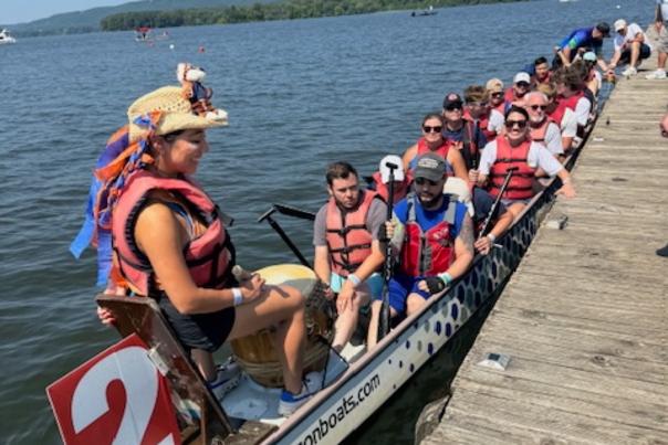A team of 20 paddlers, a drummer and a steerer await their turn to race in a 46-foot-long traditional dragon boats on Lake Guntersville during the Scottsboro Dragon Boat Race and Festival.