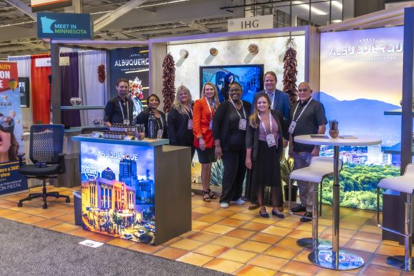 A group shot of the Visit Albuquerque team in the tradeshow booth at the ASAE Annual Meeting